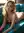 Young blonde lounging nude on couch