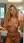 Blonde beach model selfie in pink bikini