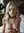 Platinum blonde on knees with leash