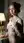 Redhead lifts tank top in marble bath