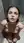 Brunette kneeling wet in shower