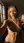 Topless selfie in sunlit studio