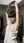 Slim brunette topless dressing room pose