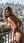 Nude curvy blonde balcony railing pose