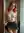 Redhead lifts skirt showing tits