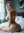 Platinum blonde nude bedroom over-shoulder
