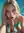 Layla leaning over the pool in turquoise bikini