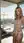 Blonde lifts sheer swimsuit on rooftop
