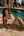 Poolside wet skin in white tank top and towel