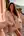 Slim athletic brunette shows natural tits on ocean balcony