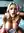 Daphne kneeling on bed sultry boudoir scene