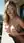 Blonde blue eyes balcony topless pose