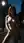 Slim brunette nude on city street