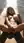 Blonde fingers herself on wet sand