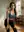Nisha in teal sports bra during studio stretch