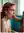 Athletic redhead topless at desk