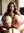 Sofia kneeling on the bed