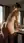Nude hotel bathroom over shoulder