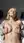 Blonde topless open hoodie on bed