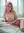 Pink lace lingerie on bedroom sheets