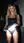 Blonde lifts dress on street