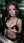 Brunette cups breast in elevator