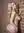 Blonde nude over-shoulder brick wall