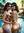Two brunettes pressed close in pool