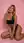 Blonde cleavage push on pink floor