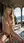 College blonde cowgirl on terrace