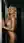 Mid-20s curvy nude hallway pose