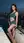 Slim brunette rooftop poolside