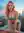 Curvy pink hair cleavage on rooftop