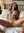 Young Latina spreads on bed