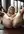 Legs spread wide on gym mat