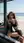 Brunette straddles lap on beach
