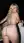 Nude blonde spreads on balcony