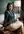 Curvy brunette ass on classroom desk