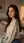 Wavy brunette over-shoulder glance