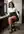 Curvy Latina legs crossed in office