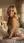 Satin slip dress over-the-shoulder glance