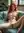 Redhead spreads legs on couch