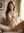 Young adult nude on beige couch