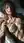 Oiled blonde nude in bed selfie