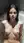 Brunette topless in sunlit bathtub