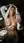 Curvy blonde lifts blouse in study