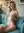 Nude blonde squeezes breasts on couch
