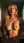 Nude blonde topless bedroom portrait