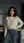 Asian in kitchen sweater jeans