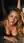 Green eyes, wet blonde hair, topless